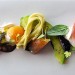 The beautiful assortment of Sicilian trumbetta zucchini, burrata 'artigiana', and heirloom tomatoes at JAAN.
